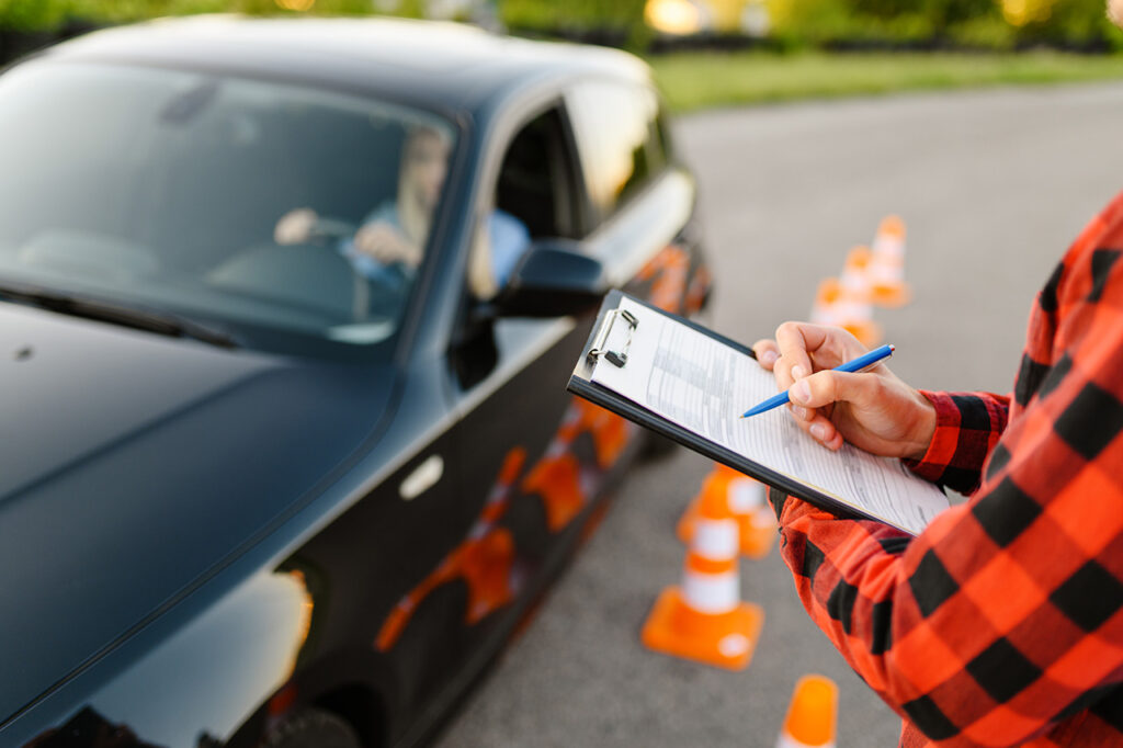 Instructor teaching parking techniques during driving lesson in Mission BC